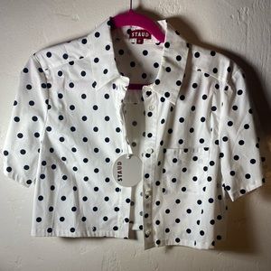 White STAUD M cropped button down top adorned with ying yang symbols+ black dots